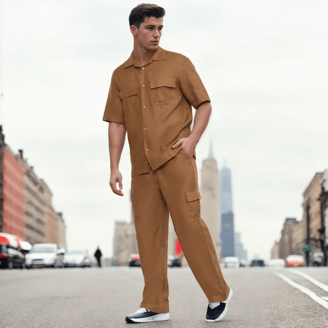 Man in modern tan button-up shirt and matching pants posing on city street